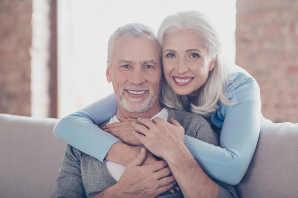 Portrait of happily married mature couple hugging